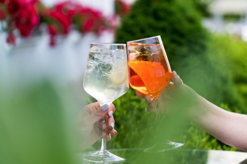 Making celebratory toast with summer cocktails